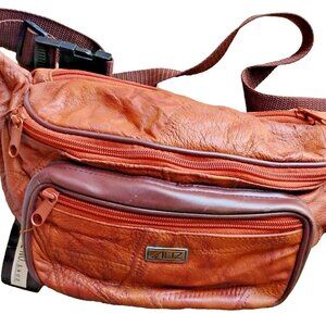 Womens Genuine Leather Fanny pack. Brand new. Adjustable Strap. Several Pockets
